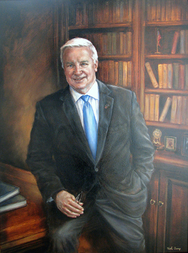 Portrait of a mand with white hair in a library wearinga suit jacket